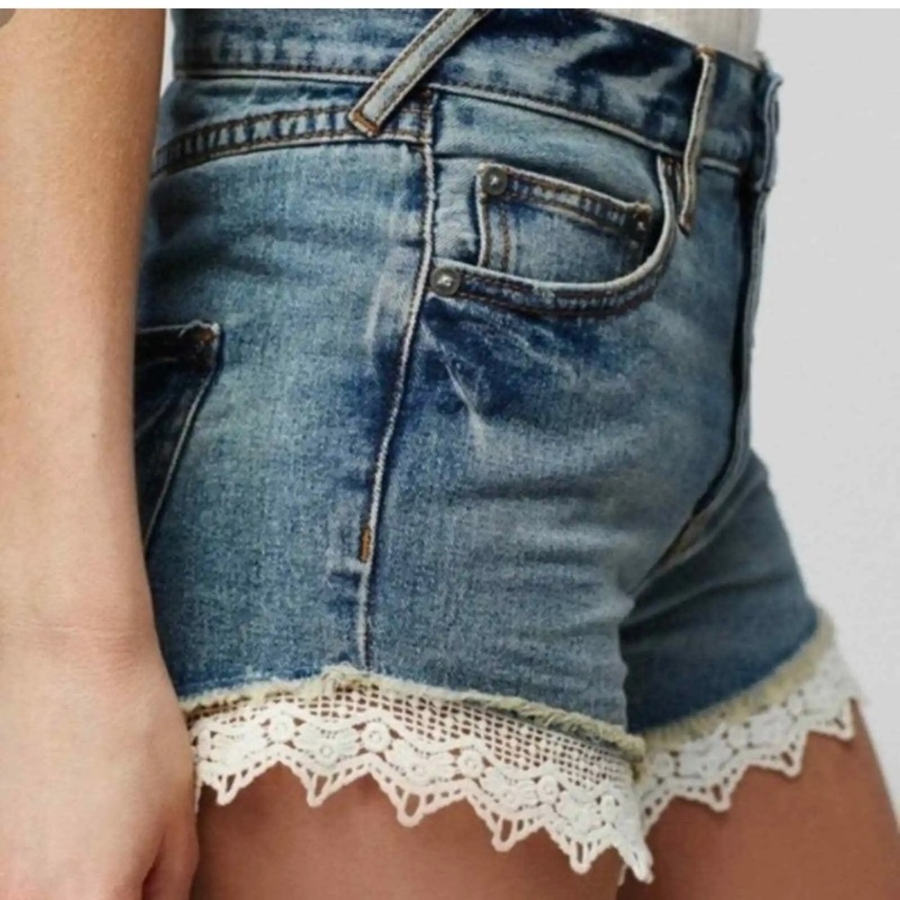 Free People Distressed Blue Denim Shorts with White Lace Trim